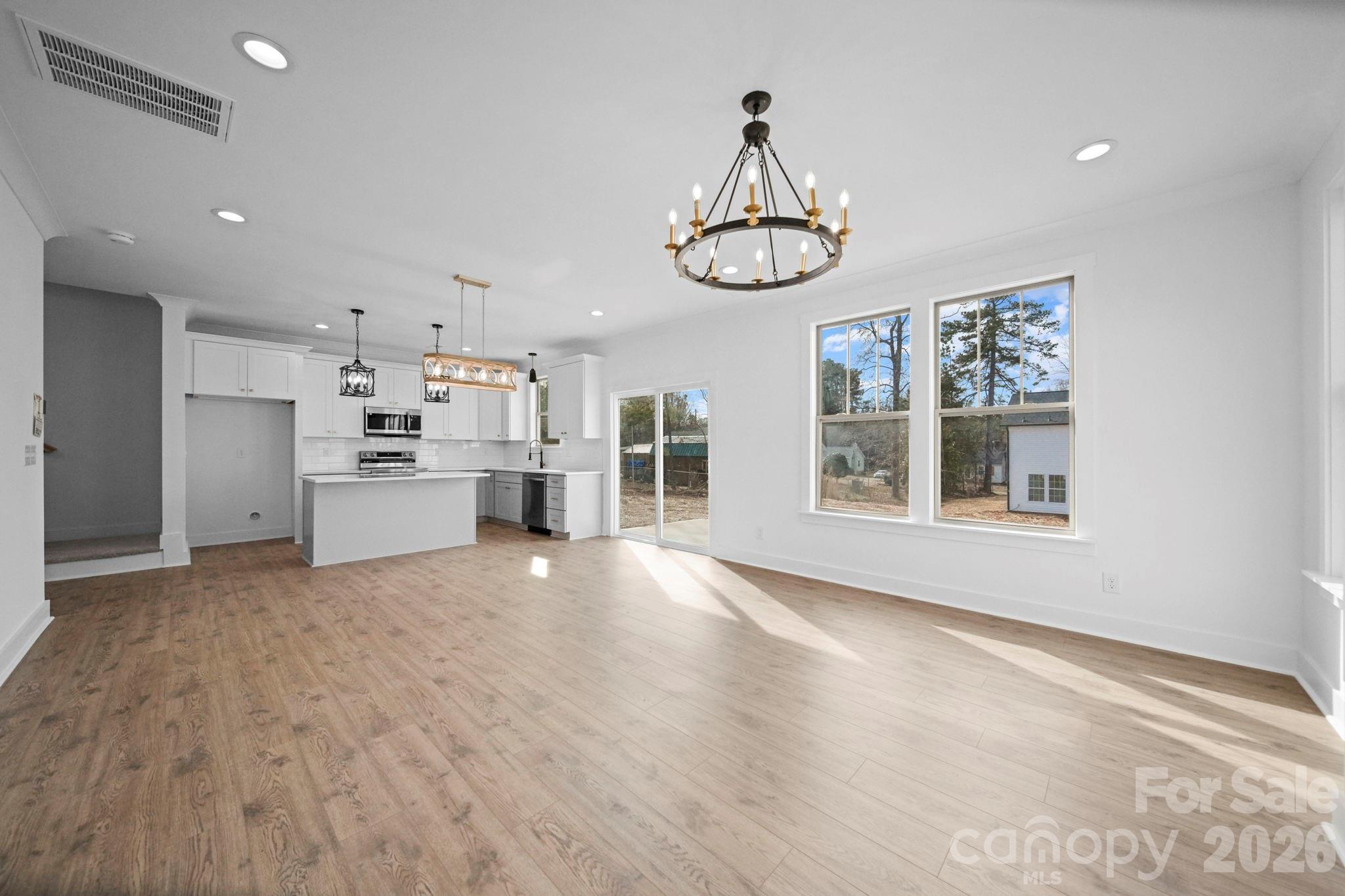 1220 Morven Road Wadesboro, NC 28170 - Photo 7 of 17 a view of a kitchen with refrigerator and microwave