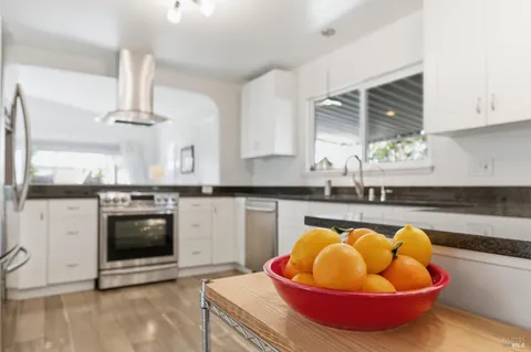 a kitchen with a sink and a stove