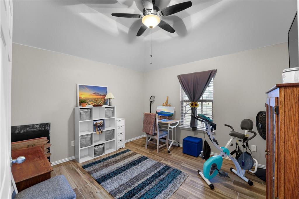 102 Avery Lane Fate, TX 75189 - Photo 20 of 30 a view of a room with gym equipment