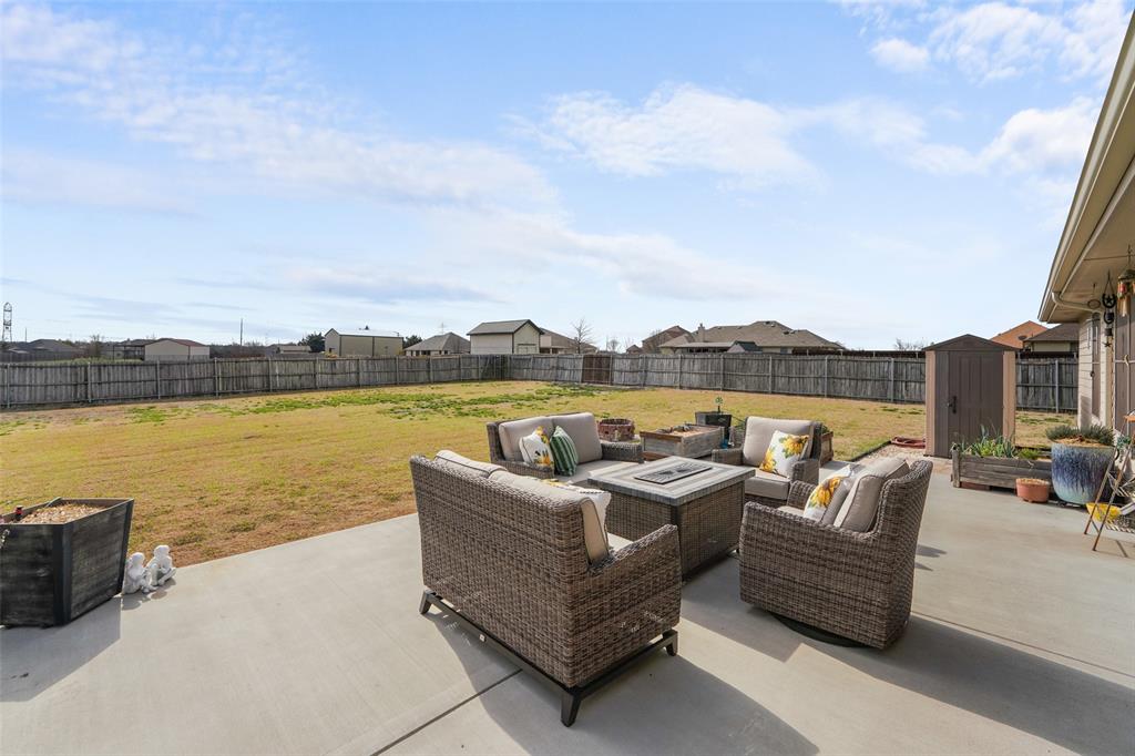 102 Avery Lane Fate, TX 75189 - Photo 22 of 30 a roof deck with couches and city view