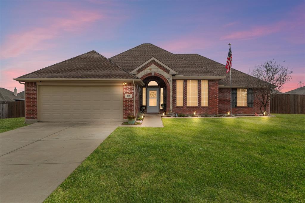 102 Avery Lane Fate, TX 75189 - Photo 24 of 30 a front view of a house with a garden