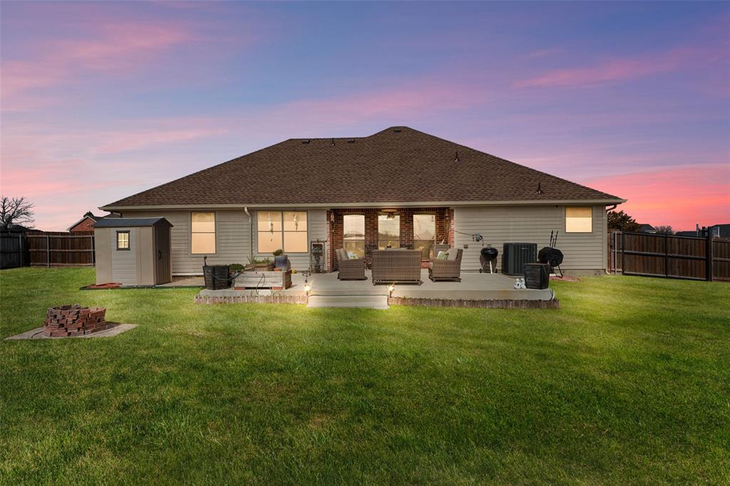 102 Avery Lane Fate, TX 75189 - Photo 25 of 30 a front view of a house with swimming pool having outdoor seating