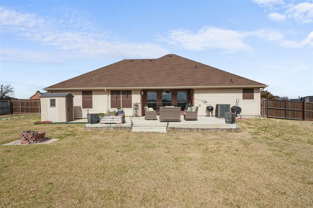 102 Avery Lane Fate, TX 75189 - Photo 26 of 30 a view of a house with backyard and sitting area
