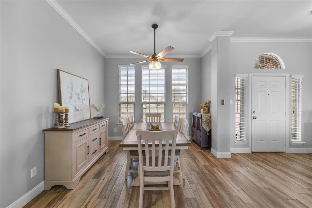 102 Avery Lane Fate, TX 75189 - Photo 4 of 30 a view of a dining room with furniture window and wooden floor