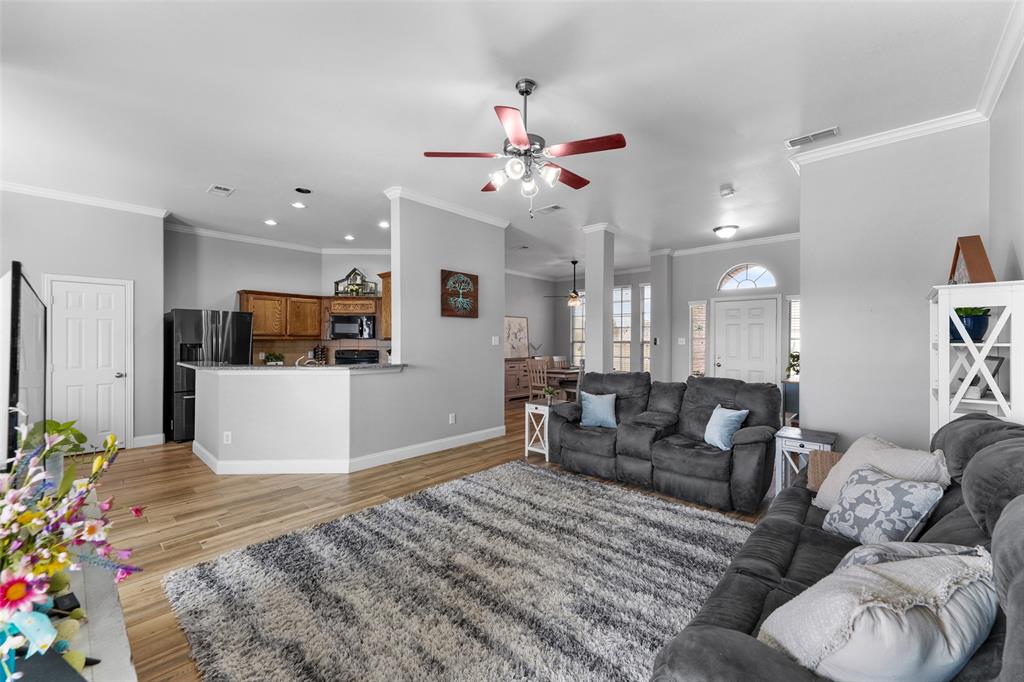 102 Avery Lane Fate, TX 75189 - Photo 8 of 30 a living room with furniture kitchen view and a potted plant