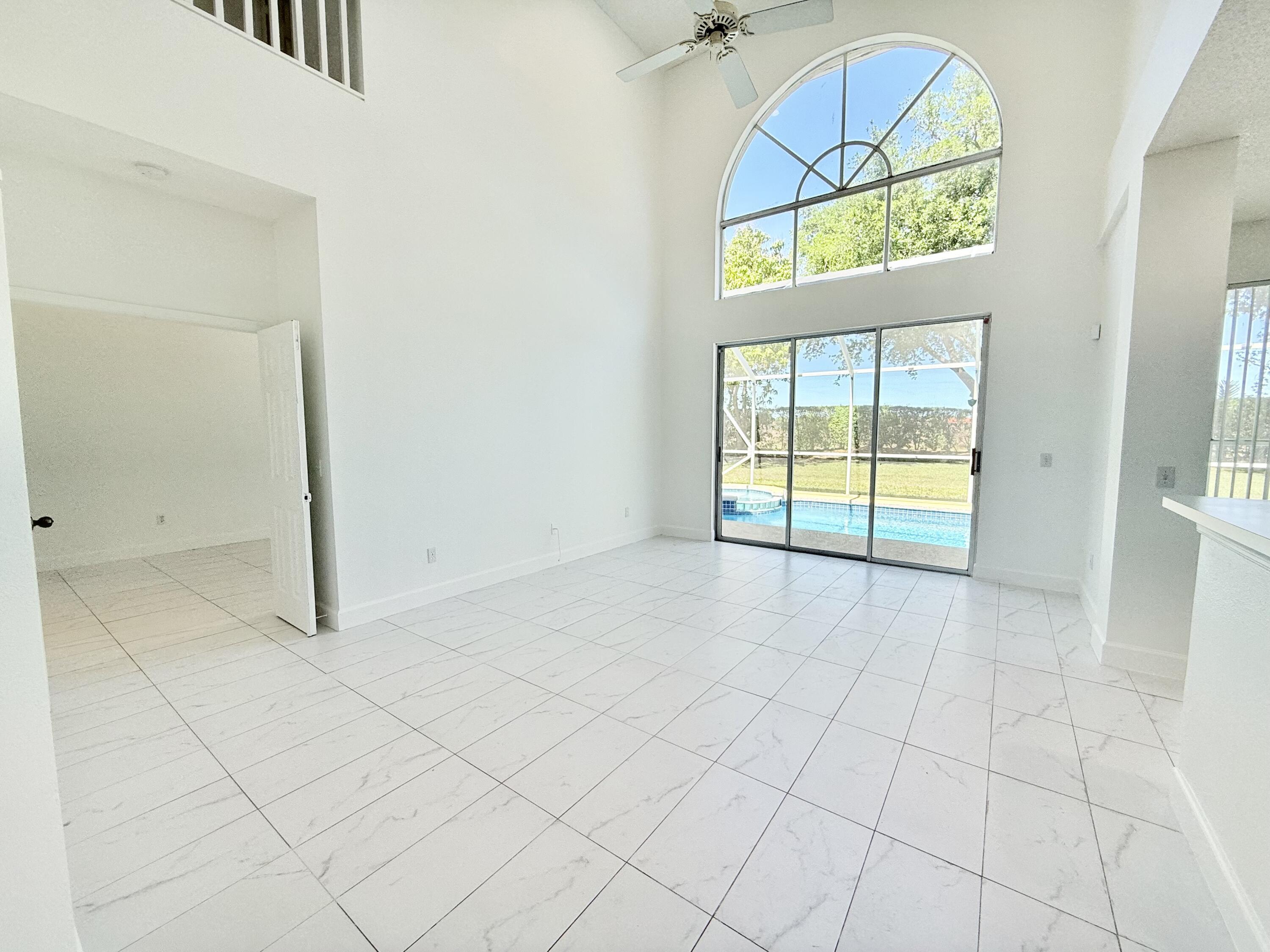 10875 Old Bridgeport Lane Boca Raton, FL 33498 - Photo 4 of 39 KITCHEN OVERLOOKING POOL AND FAMILY ROOM