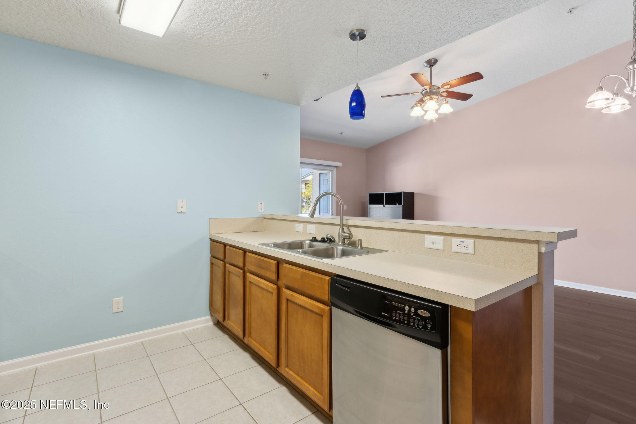 3700 Kirkpatrick Circle, Unit 811 Jacksonville, FL 32210 - Photo 14 of 29 a kitchen with a sink a chandelier and a stove