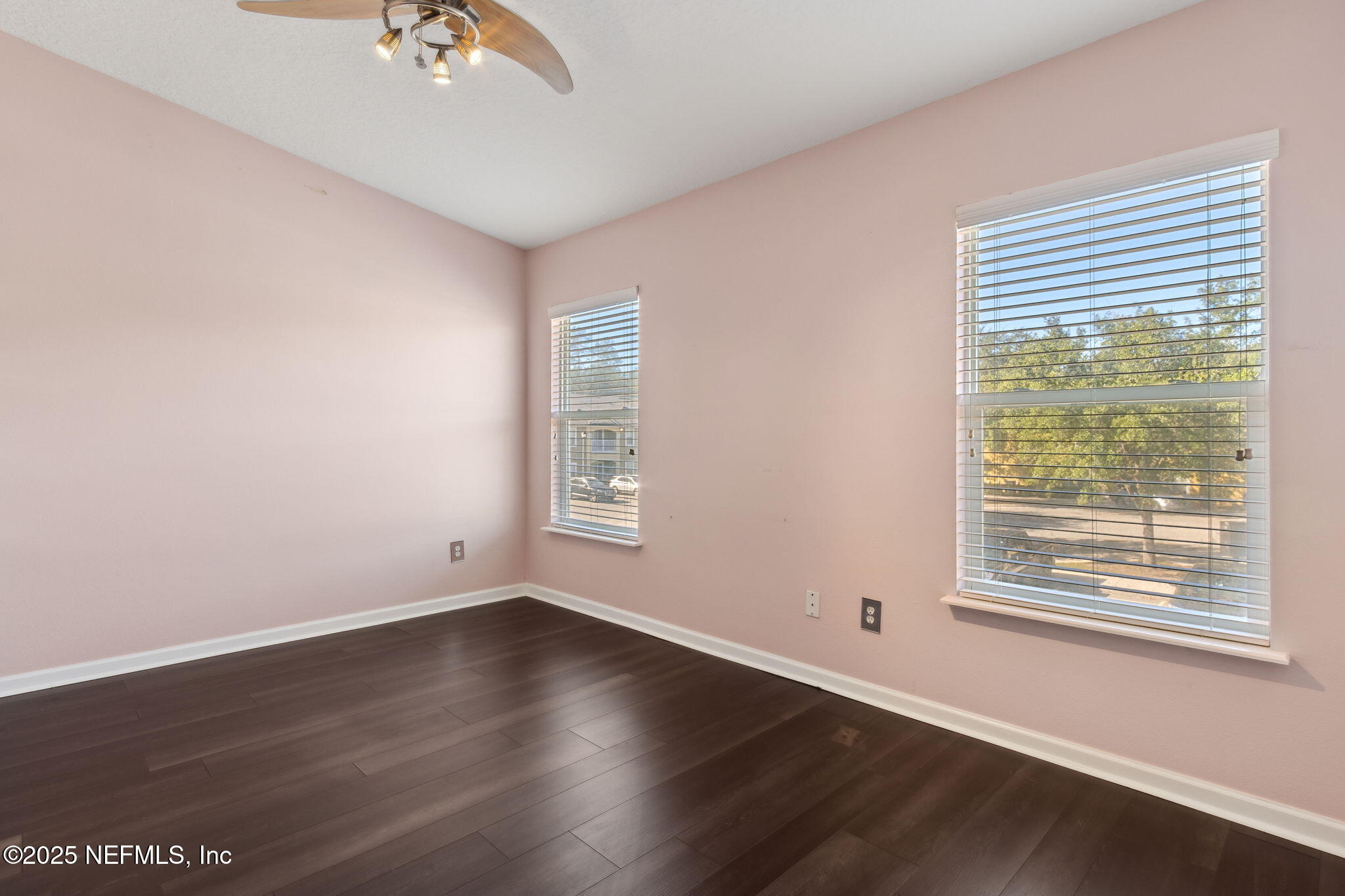 3700 Kirkpatrick Circle, Unit 811 Jacksonville, FL 32210 - Photo 18 of 29 a view of an empty room with wooden floor and a window