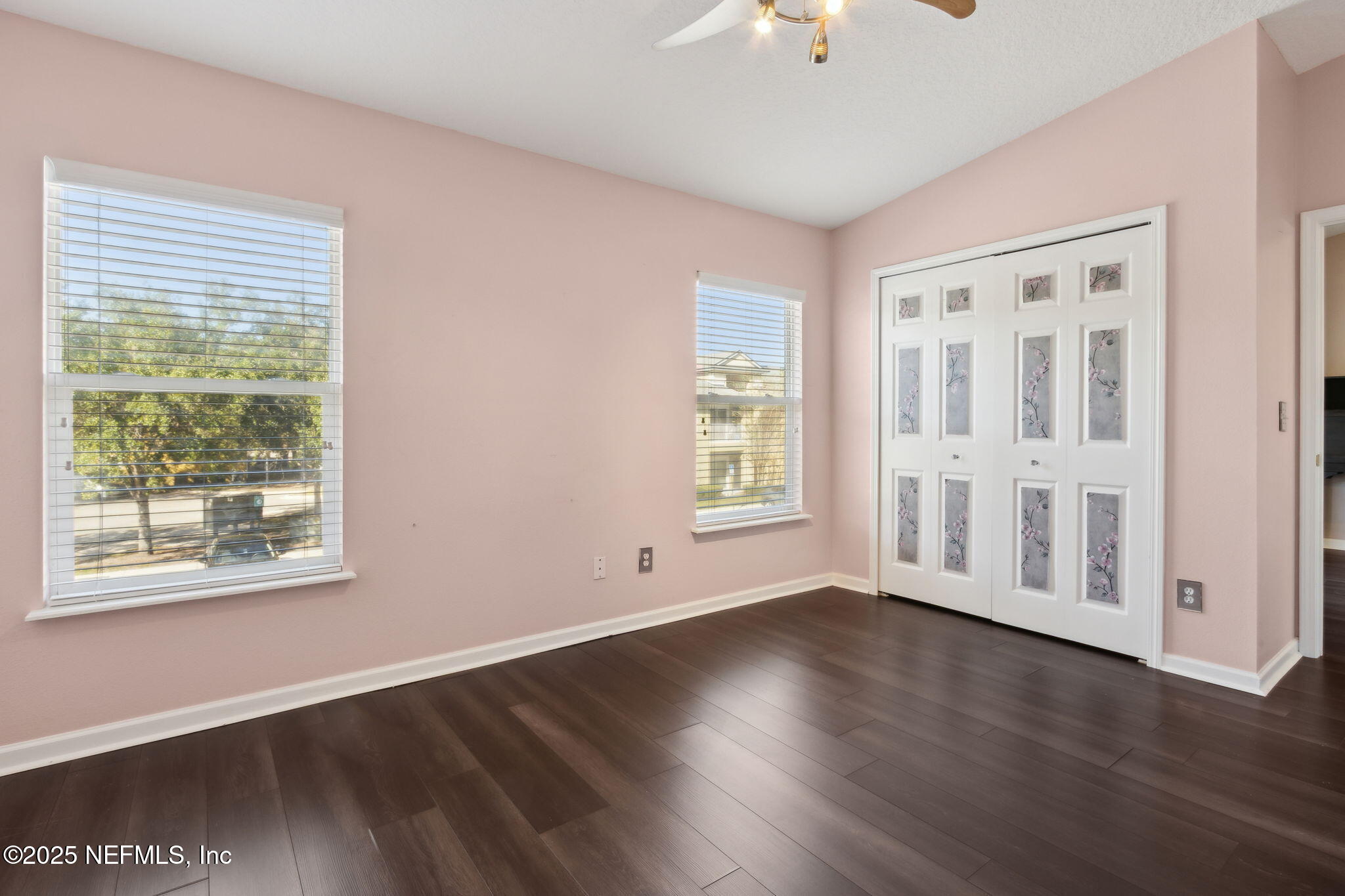 3700 Kirkpatrick Circle, Unit 811 Jacksonville, FL 32210 - Photo 21 of 29 a view of an empty room with wooden floor and a window