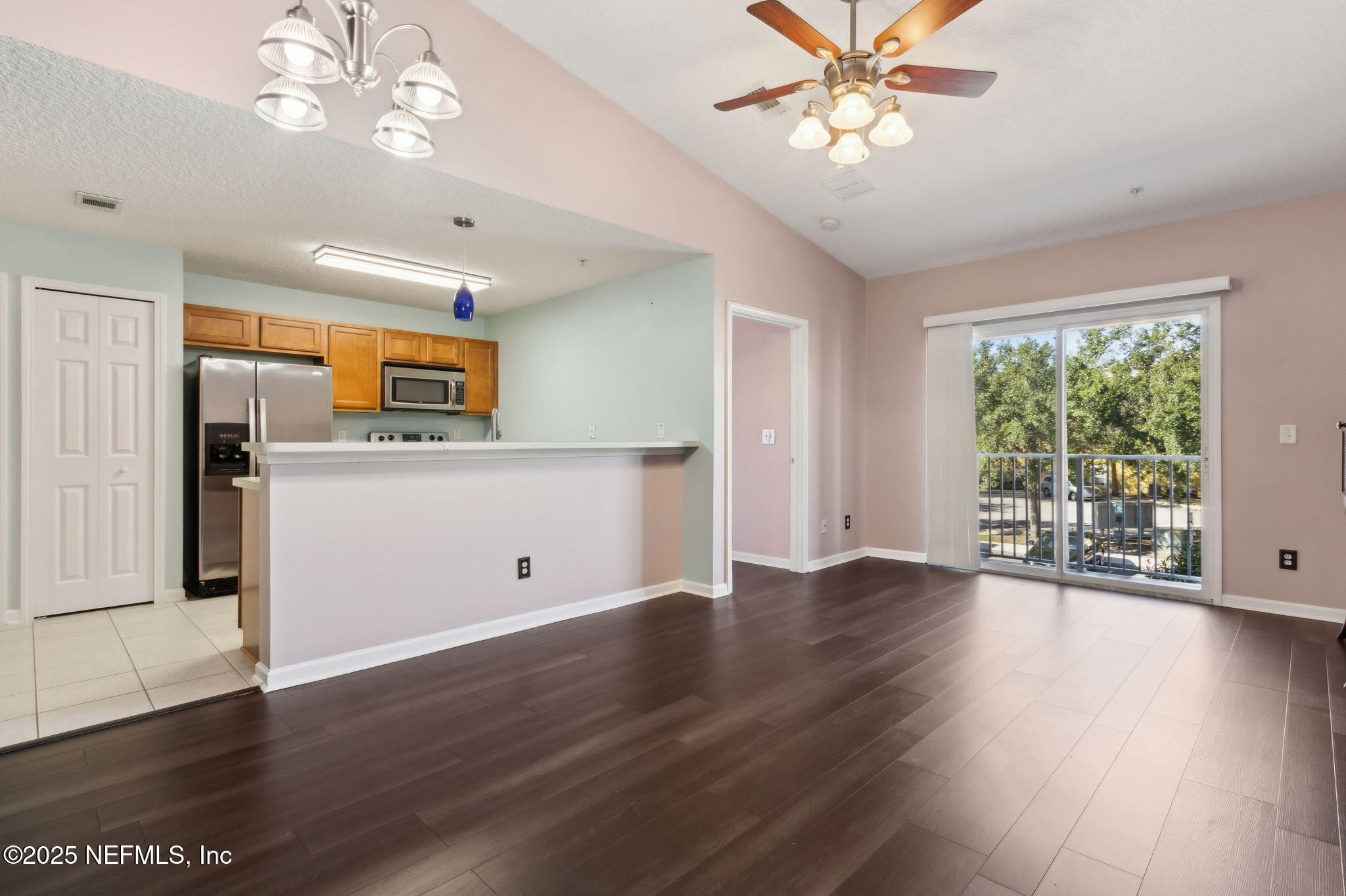 3700 Kirkpatrick Circle, Unit 811 Jacksonville, FL 32210 - Photo 5 of 29 a view of a kitchen with a dishwasher cabinets and wooden floor