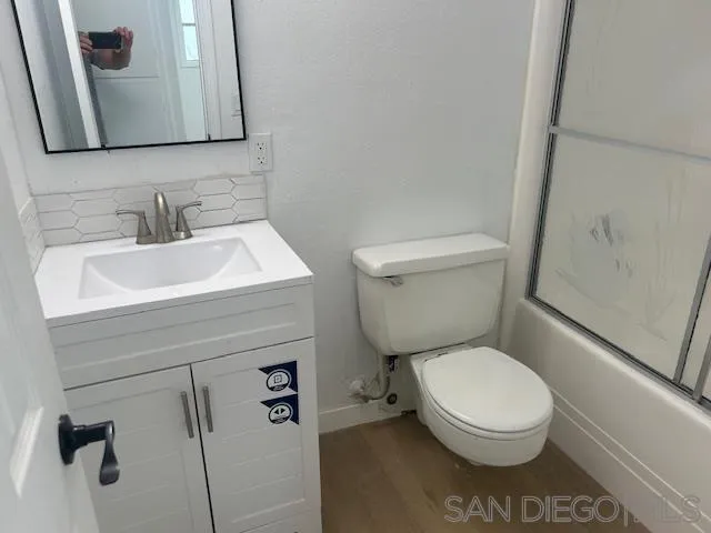 13520 Carriage Road Poway, CA 92064 - Photo 14 of 19 a bathroom with a toilet sink and mirror