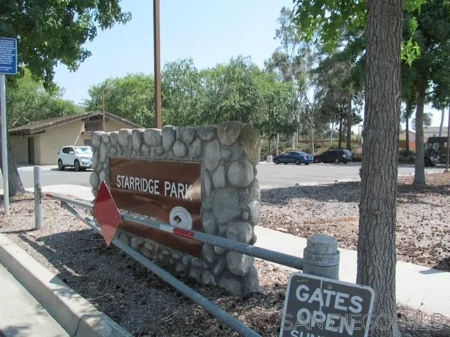 13520 Carriage Road Poway, CA 92064 - Photo 17 of 19 a street sign on a sidewalk next to a road