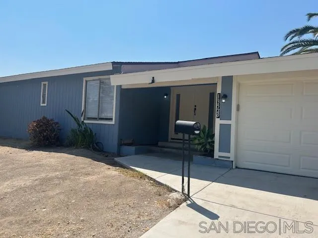 13520 Carriage Road Poway, CA 92064 - Photo 5 of 19 a living room with a potted plant