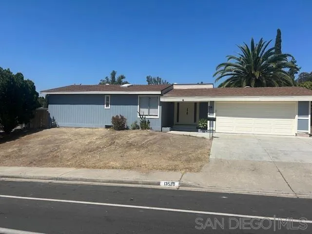 13520 Carriage Road Poway, CA 92064 - Photo 7 of 19 a view of a house with a yard and potted plants