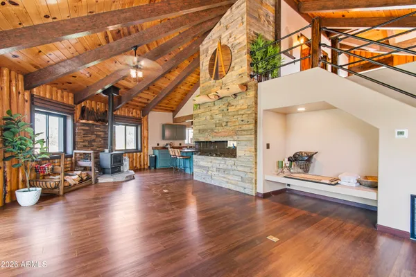 a dining table with chairs and chandelier