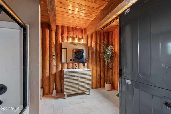 a view of a room with wooden floor