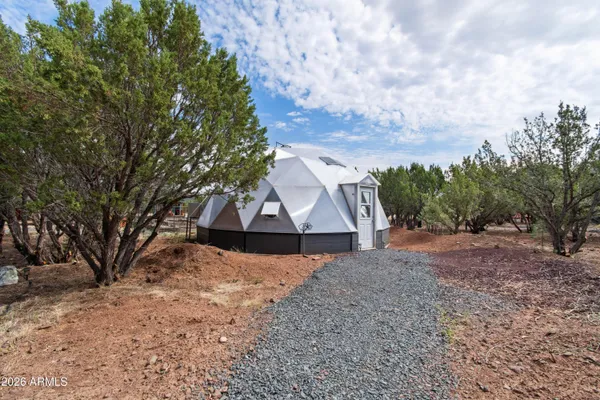 a backyard of a house with lots of green space