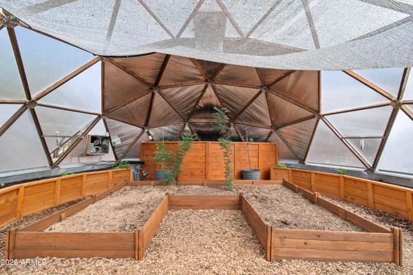 a view of a yard with cars