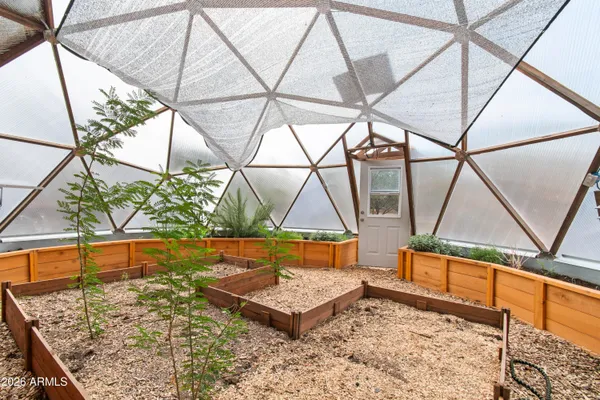 a view of a backyard with sitting area