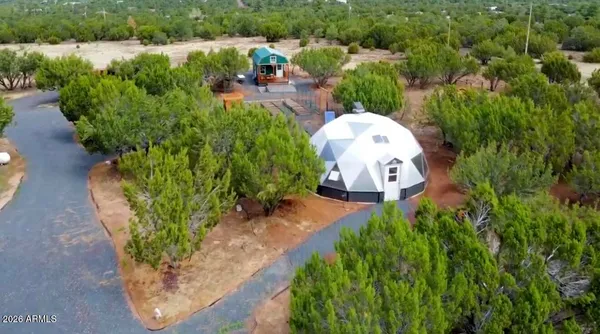 an aerial view of a house with outdoor space