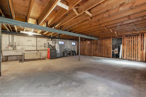 a view of empty room with wooden ceiling