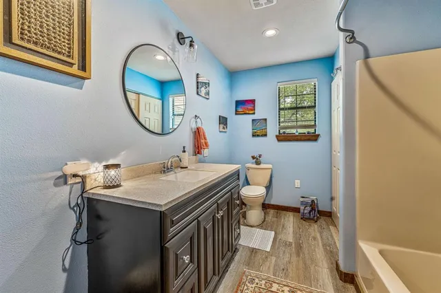 a bed room with a bed and a chair