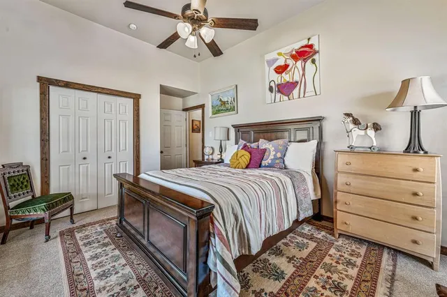 a living room with furniture a table and a chandelier