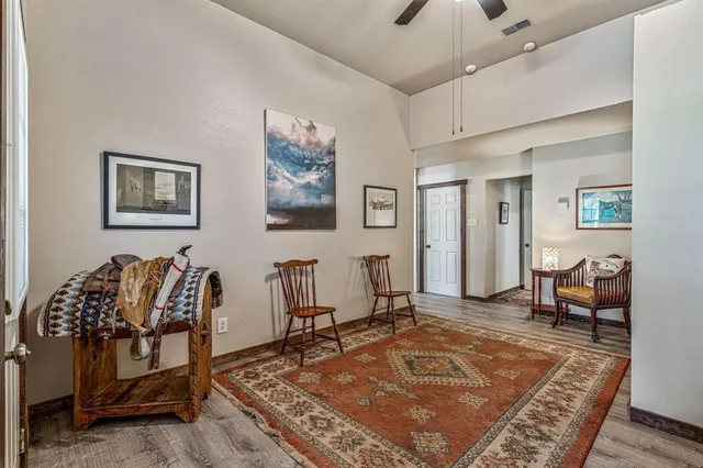 a kitchen with stainless steel appliances granite countertop a sink a stove and cabinets