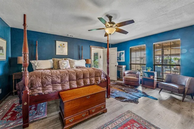 a view of a backyard with wooden fence