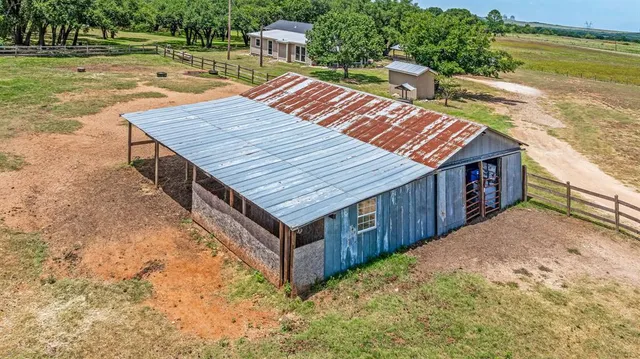 an aerial view of a house with a ocean view