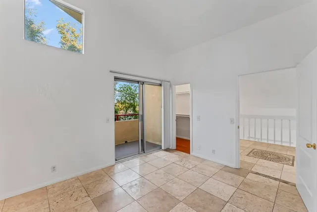 a view of a two chairs in the balcony