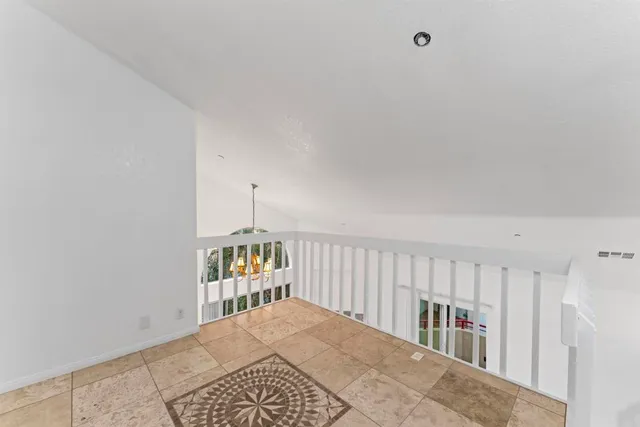 a bedroom with furniture and window