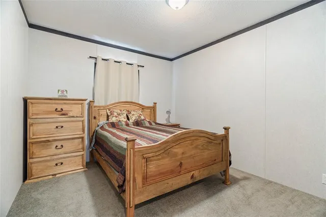 a bedroom with a bed and a cabinets
