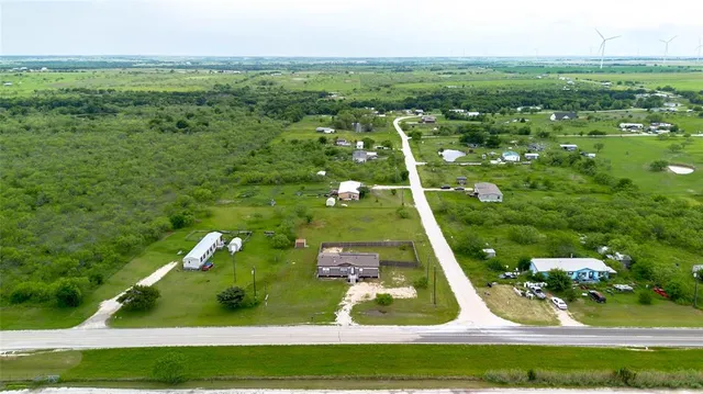 a view of a swimming pool with a yard