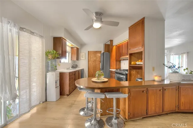 a kitchen with a refrigerator stove and sink