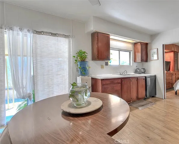 a bedroom with a flat screen tv and a bed