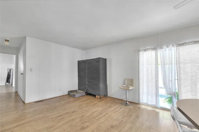 a view of an entryway with wooden floor and windows