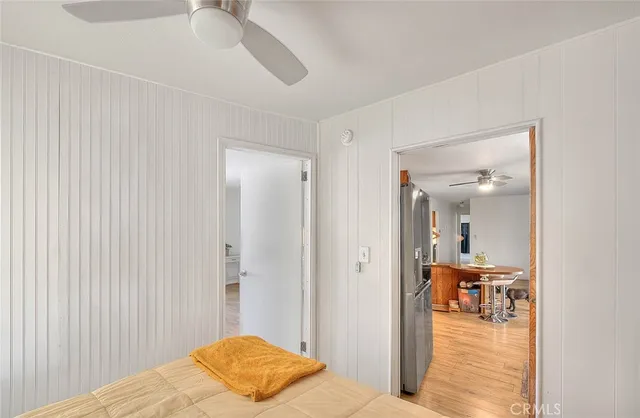 a view of entryway with wooden floor and a table chair
