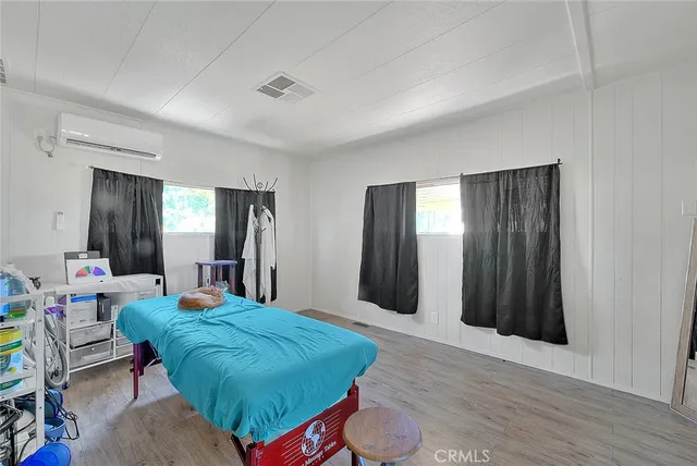 a view of backyard with outdoor seating and plants