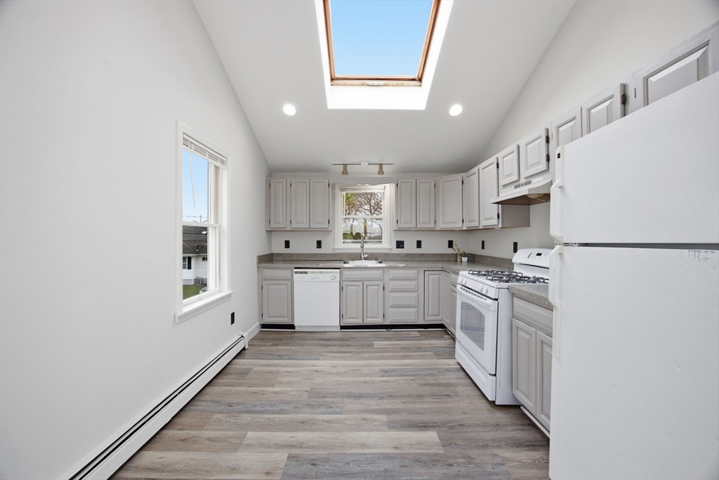 192 Swifts Beach Road Wareham, MA 02571 - Photo 18 of 38 a kitchen with white cabinets stainless steel appliances and sink
