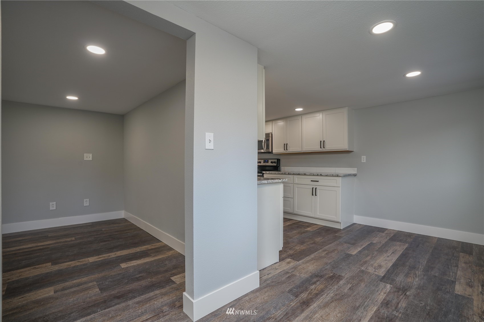 8126 Canyon Road East Puyallup, WA 98371 - Photo 24 of 37 a view of kitchen with wooden floor