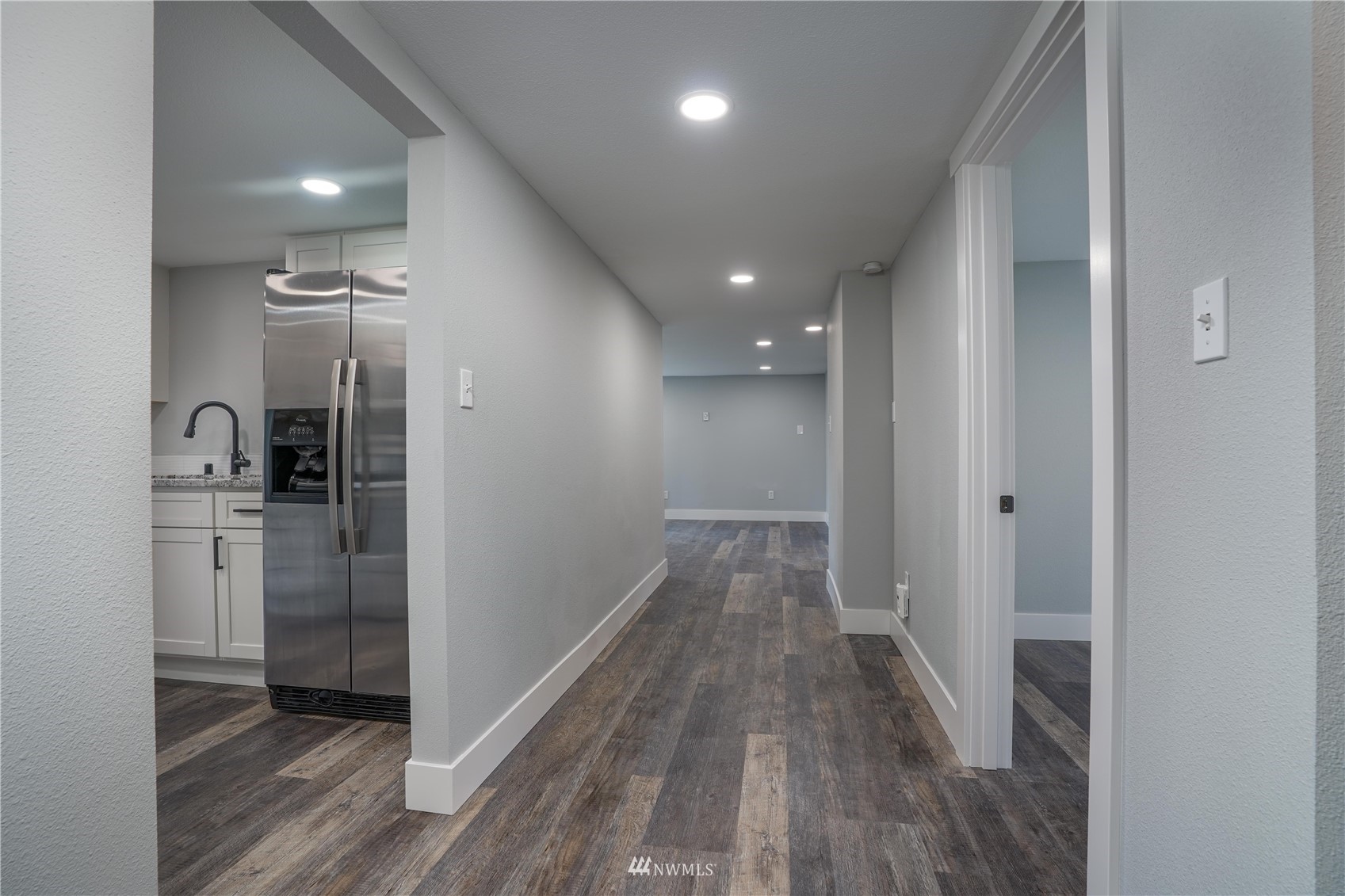 8126 Canyon Road East Puyallup, WA 98371 - Photo 25 of 37 a view of hallway with wooden floor