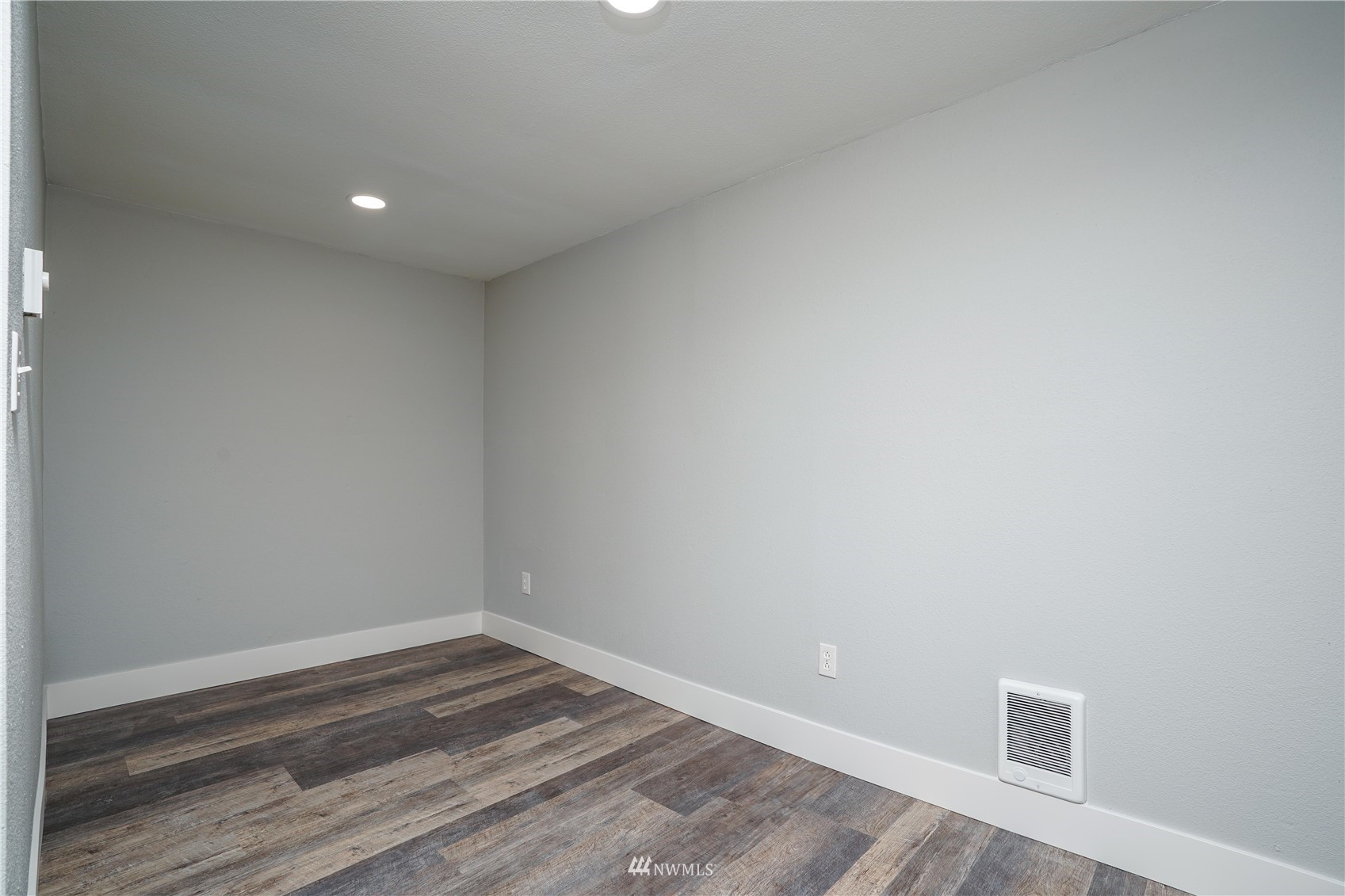 8126 Canyon Road East Puyallup, WA 98371 - Photo 28 of 37 a view of empty room with wooden floor