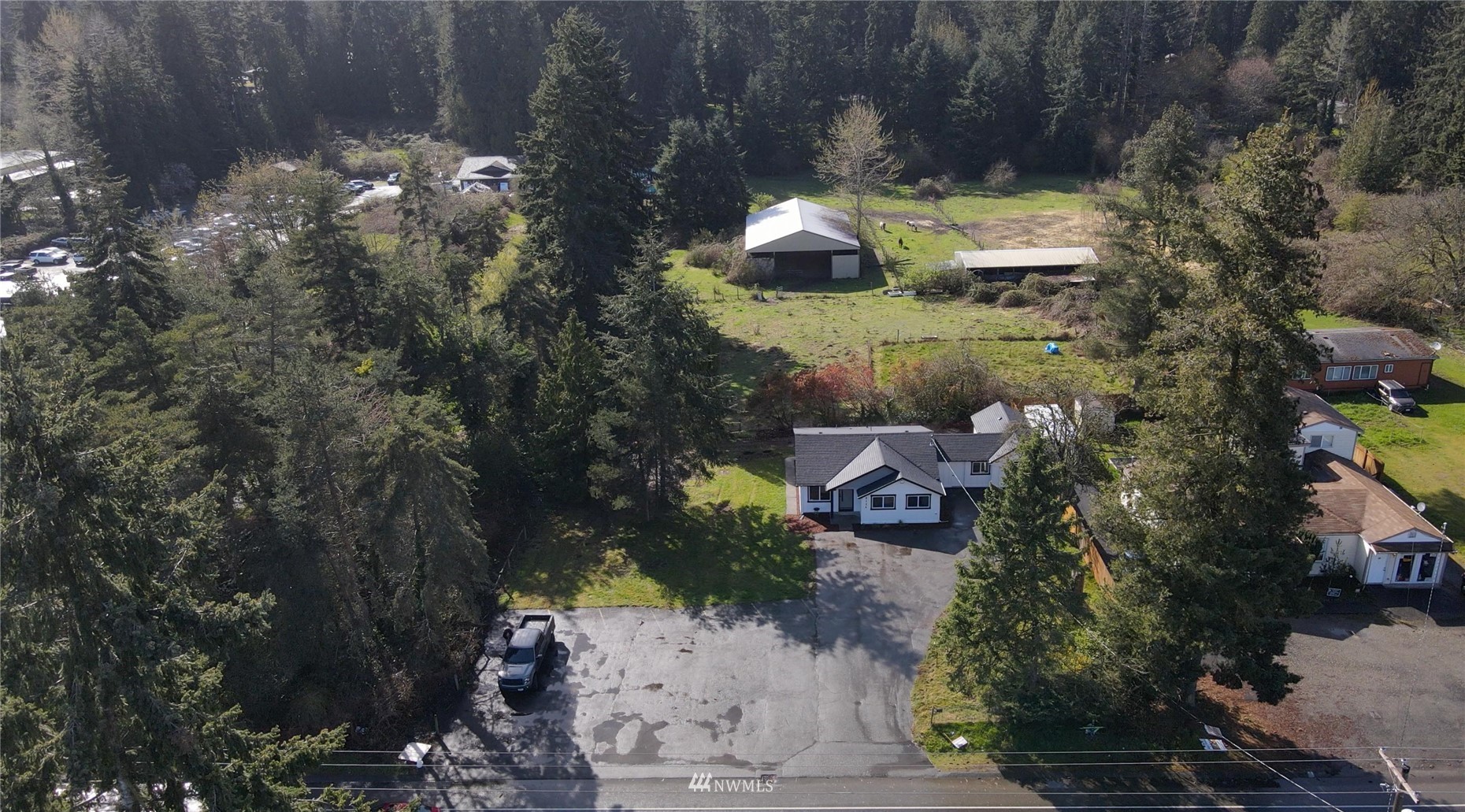 8126 Canyon Road East Puyallup, WA 98371 - Photo 30 of 37 an aerial view of a house with a yard