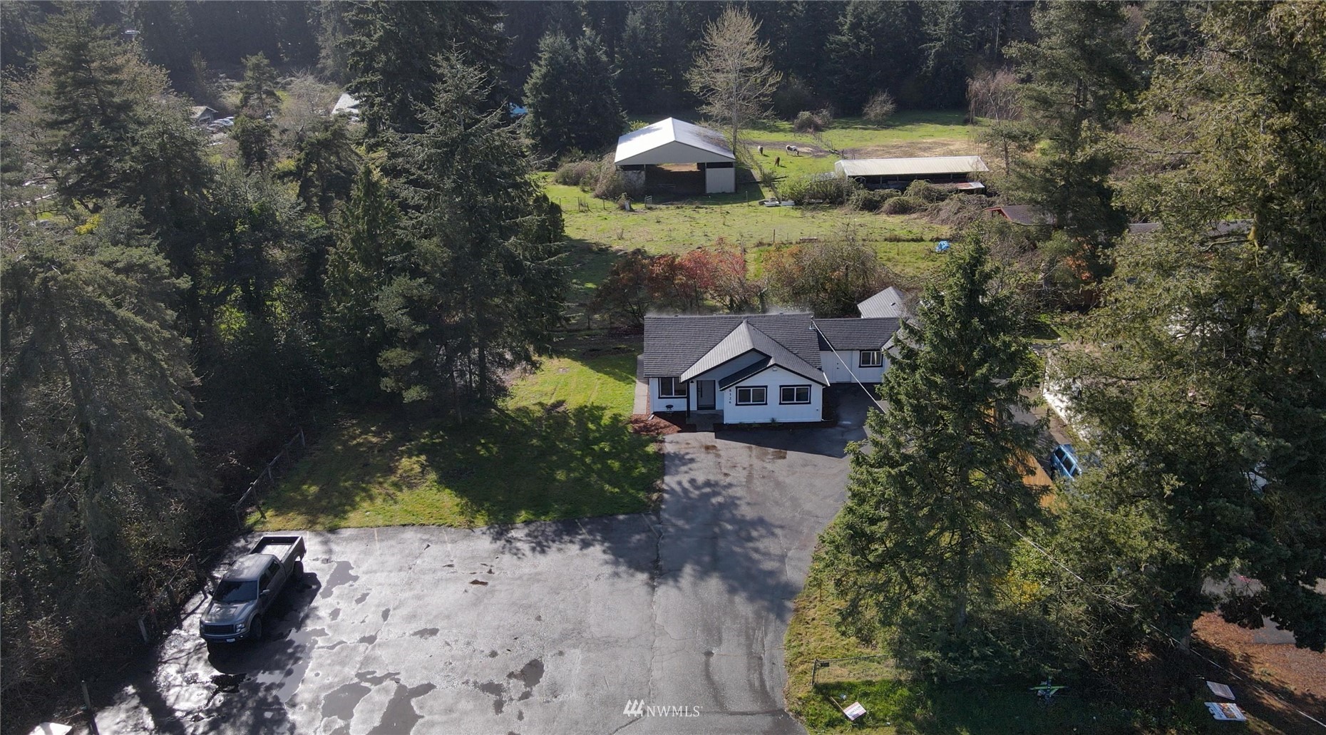 8126 Canyon Road East Puyallup, WA 98371 - Photo 31 of 37 a view of a house with a yard and sitting area