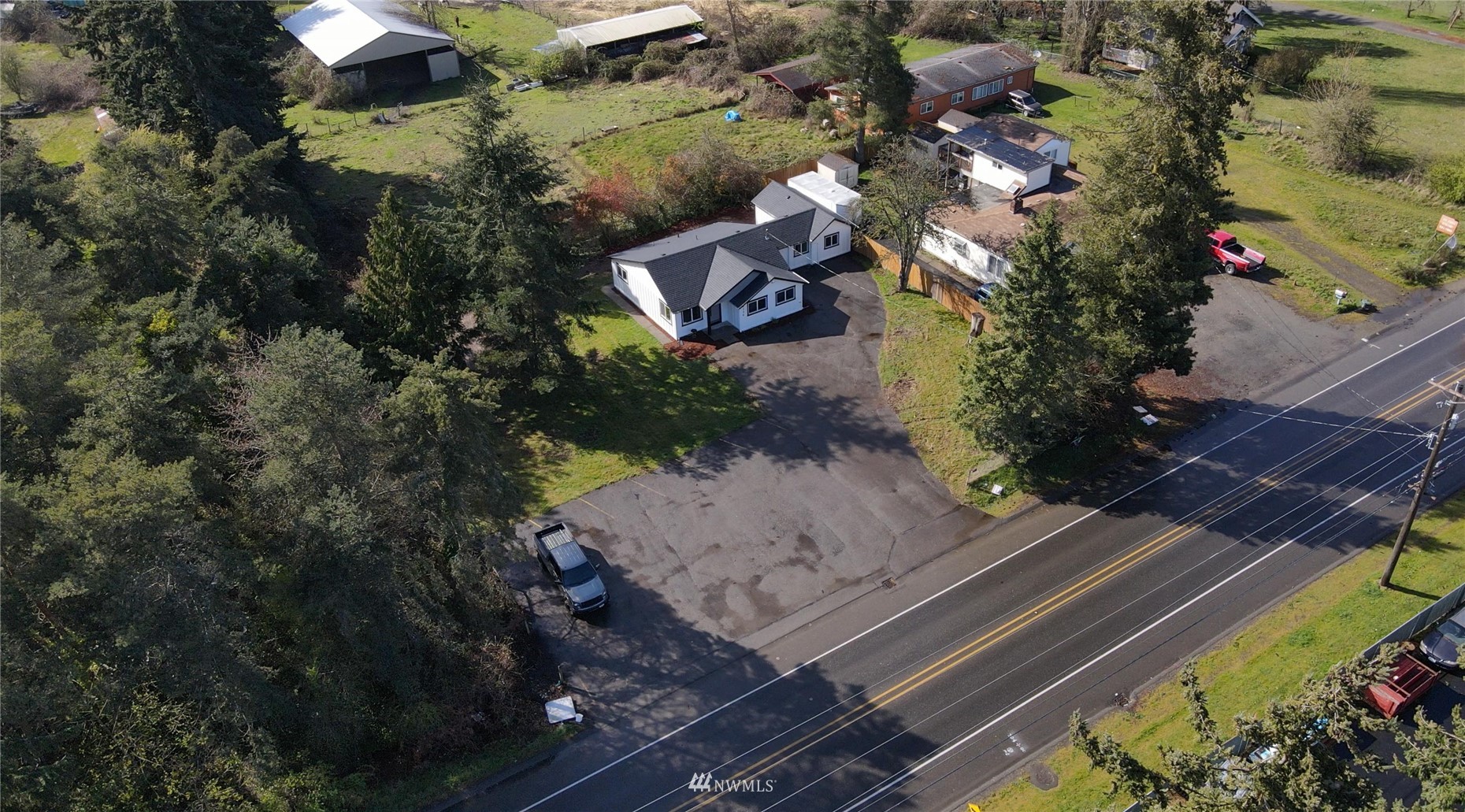 8126 Canyon Road East Puyallup, WA 98371 - Photo 32 of 37 an aerial view of a house with a yard