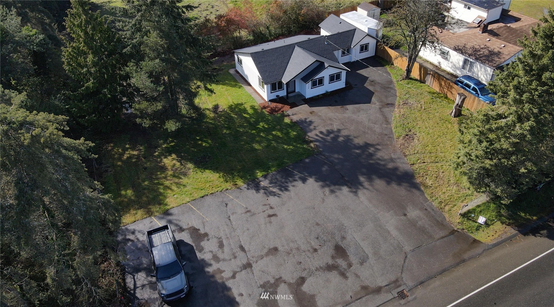 8126 Canyon Road East Puyallup, WA 98371 - Photo 33 of 37 an aerial view of a house with a yard