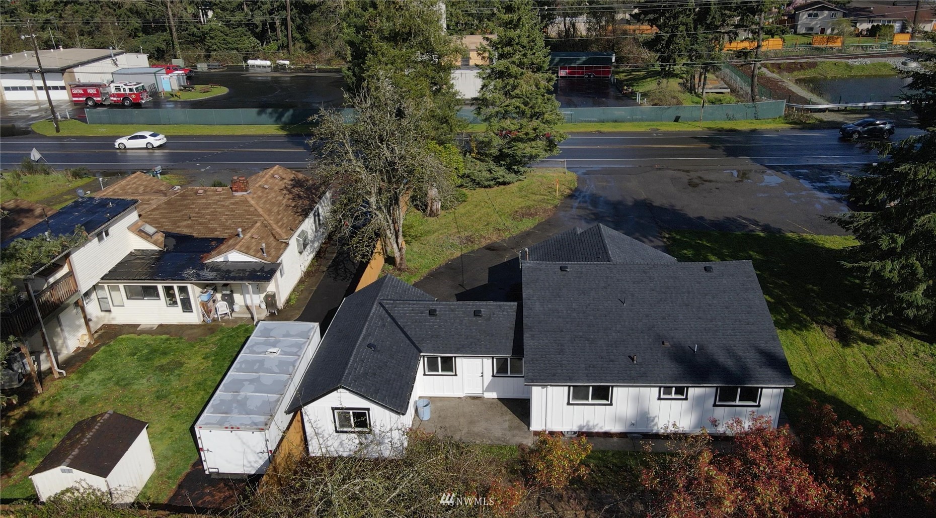 8126 Canyon Road East Puyallup, WA 98371 - Photo 37 of 37 an aerial view of multiple houses with yard