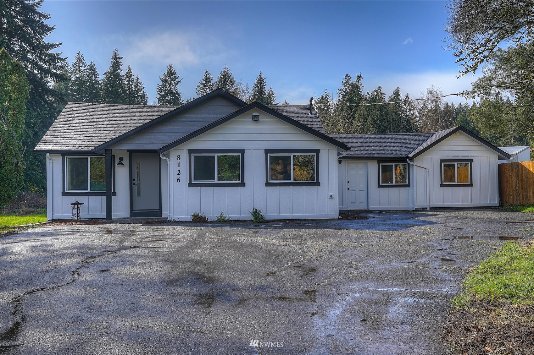 8126 Canyon Road East Puyallup, WA 98371 - Photo 5 of 37 a view of a house with a yard