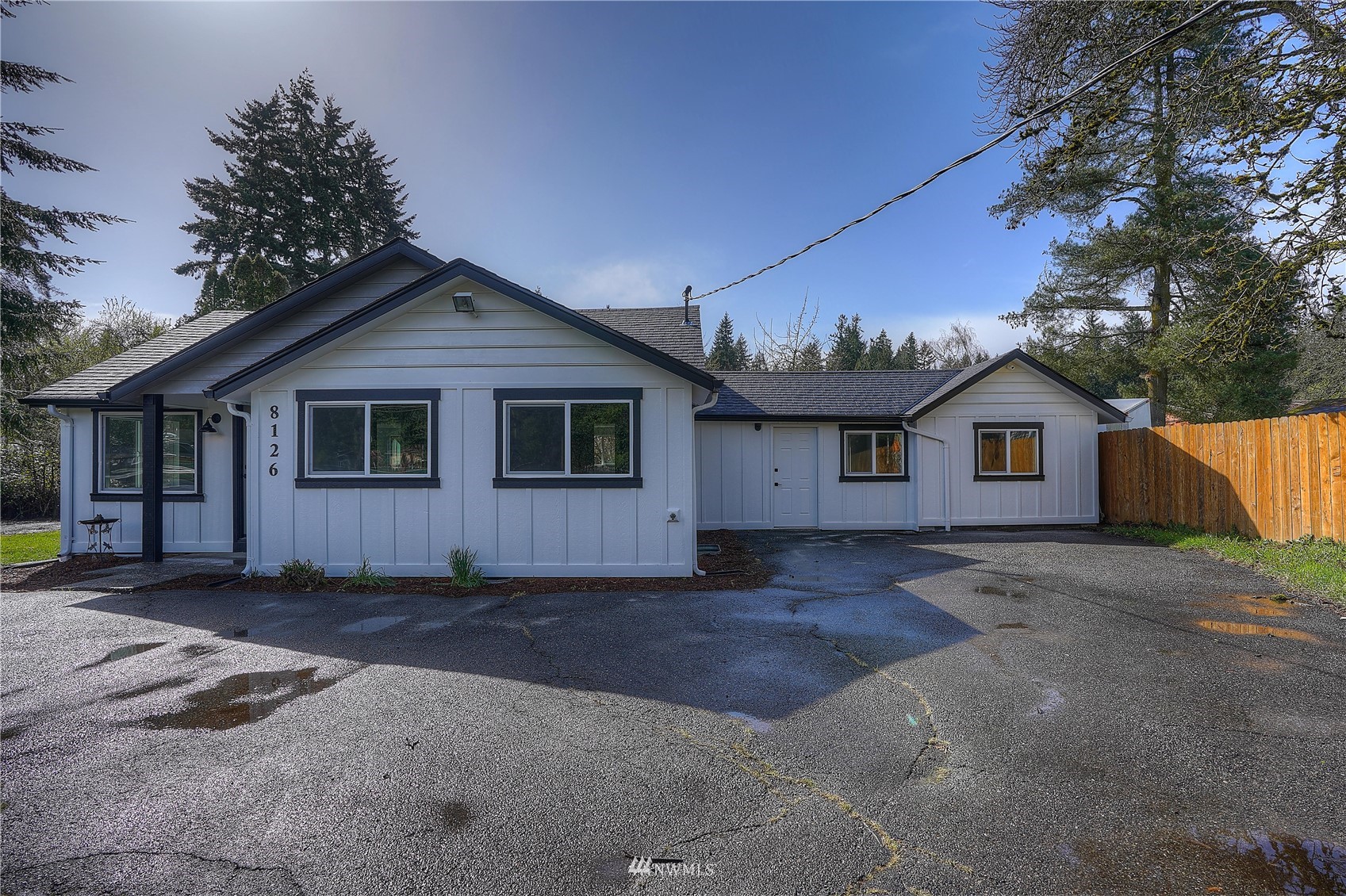 8126 Canyon Road East Puyallup, WA 98371 - Photo 6 of 37 a view of a house with a yard